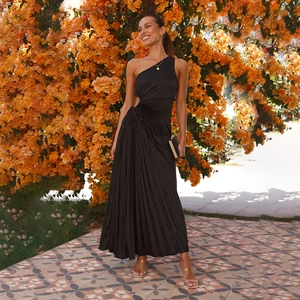 Detailed view of black pleated fabric and side cutout design on a one-shoulder maxi dress