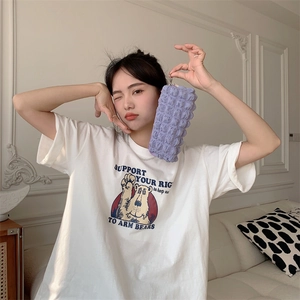 White cotton t-shirt and purple bubble texture stationery bag shown by a model