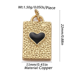 Detailed view of 22mm x 11mm hammered copper pendant with a black heart center