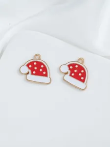 Detail of red and white enamel Christmas hat charms for DIY jewelry making
