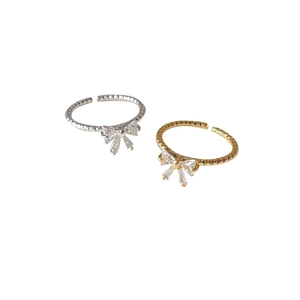 French style bow-shaped adjustable open ring with sparkling cubic zirconia in gold and silver
