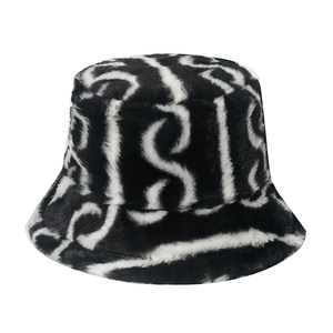 Plush faux fur bucket hat with black and white wavy spiral pattern for winter warmth