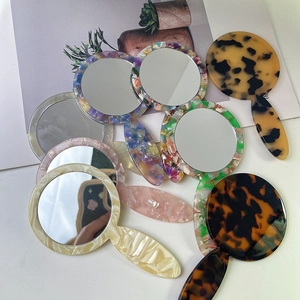 Chic handheld acetate makeup mirrors in assorted marble patterns and tortoiseshell finish