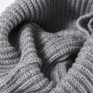 Thick grey knitted wool hat with warm ribbed texture and premium stitching detail