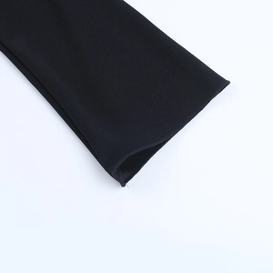 Close-up of the black long sleeve cuff detailing fine stitching on the fabric