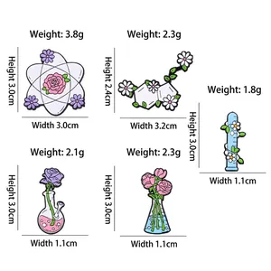 Creative enamel pins collection featuring scientific glassware with floral elements