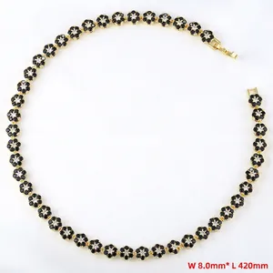 Detail view of flower necklace featuring black enamel petals and crystal centers, 8mm width