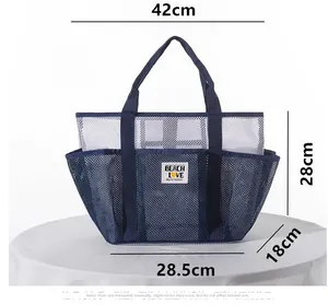 Mesh beach bag size details showing 42cm width and 28cm height with Beach Love patch