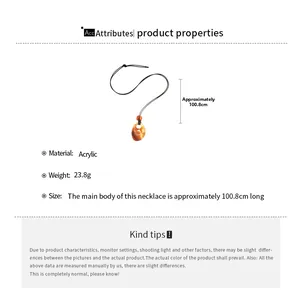 Detail view of amber acrylic bead pendant on black cord with weight and size parameters