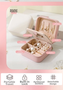 Detail view of portable leather jewelry box with mirror, necklace hooks and ring slots