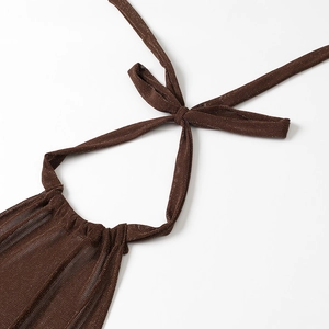 Detail of dark brown knit fabric with shimmering metallic sparkles and neat stitching