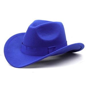 Close-up of royal blue wool felt cowboy hat with ribbon trim and wide curved brim