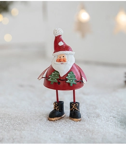 Macro shot of painted metal Santa figurine with hand-painted festive details