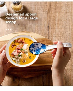 Detailed view of ceramic soup spoon with blue plum patterns and deep scoop design