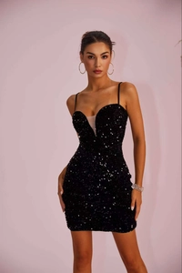 Detail of black sequined mini dress with deep V-neck and sheer mesh patchwork design