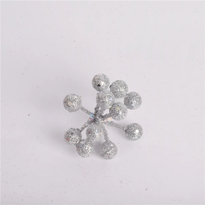 Detail of decorative silver glitter artificial berry stems for Christmas tree and wreath DIY