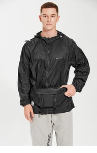 Detail of black waterproof utility chest bag with tactical buckle on men outdoor jacket