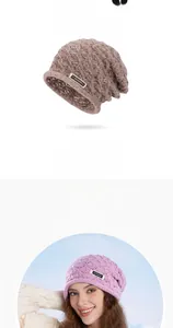 Detail of cable knit texture and brand logo label on soft winter slouchy beanie hat