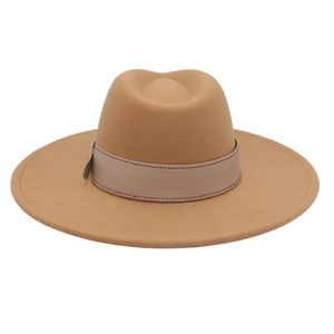 Detail of camel wool fedora hat featuring wide brim and leather band with contrast stitching