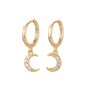 Macro view of gold-plated S925 silver crescent moon earrings with pavé cubic zirconia