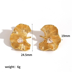 Detailed view of gold ginkgo leaf earrings with dimensions 24.5mm by 19mm and 6g weight