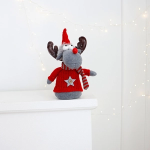Detail of Christmas reindeer doll with red knitted sweater and festive star button