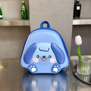 Detailed view of cute puppy hard shell backpack with blue 3D ears and durable material