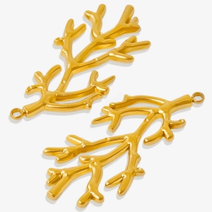 Macro detail of two golden coral branch charms made from 304 stainless steel for DIY jewelry