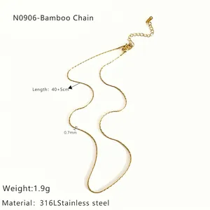 Detail view of 18K gold bamboo chain necklace with 316L stainless steel specs
