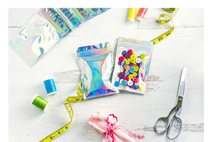Close-up of holographic laser resealable bags showing transparency and colorful reflection