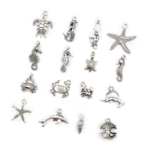 Detailed collection of silver ocean themed metal pendants including turtle and starfish