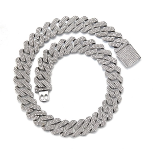 Close-up of silver iced out Cuban link chain with square clasp and triple row diamonds