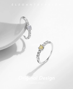 Detailed macro view of S925 sterling silver rings with yellow and white square zirconias