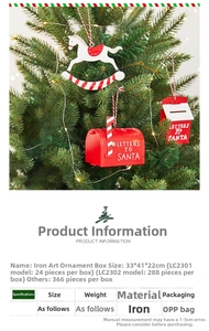 Detail of painted metal Christmas tree ornaments featuring Santa mailbox and rocking horse