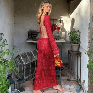 Detail of red knitted maxi dress with backless design and hollow texture pattern