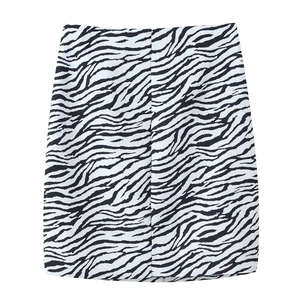 Detailed view of high-waist zebra print woven mini skirt with a black and white pattern