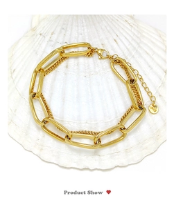 Detail of gold titanium steel double layer chain bracelet with K18 hallmark on shell