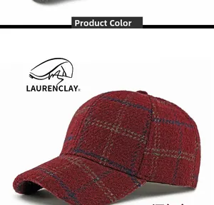 Detail of wine red plaid wool baseball cap showing premium texture and fabric pattern