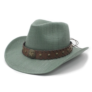 Detail of green straw cowboy hat with brown leather band and star-shaped metallic studs
