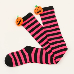 Detail of pink and black striped Halloween socks with plush pumpkin decoration