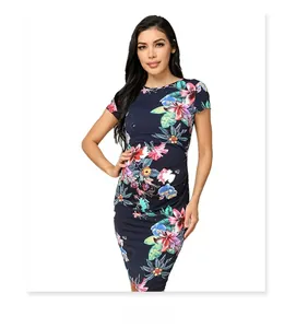 Detail of slim fit dark blue maternity dress with vibrant tropical floral print