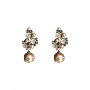 Elegant flower stud earrings with champagne pearl drops and crystal accents on white base
