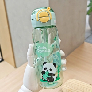 Detail of green Capybara water bottle showing cute panda graphics and straw lid