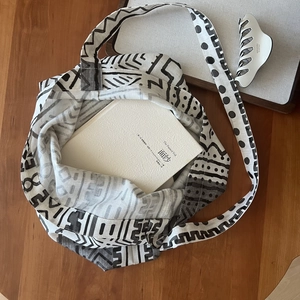 Detail of bohemian printed canvas crossbody bag with spacious interior and wide strap