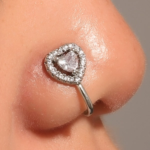 Silver-colored heart nose clip with cubic zirconia inlay on a real nose model