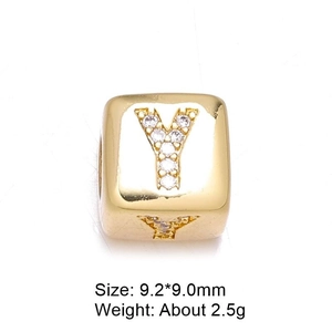 Detailed close-up of 8mm gold-plated cube bead with zircon-set letter Y for jewelry