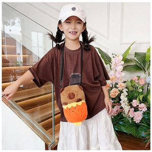 Girl wearing a cute brown plush capybara crossbody bag on indoor stairs with flowers