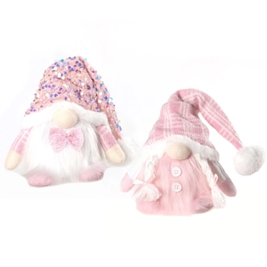 Set of two pink glowing Christmas gnomes with sequins and knit hats for desktop decor