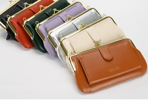 Close-up of stylish PU leather crossbody bags in seven vibrant colors with metal clasps