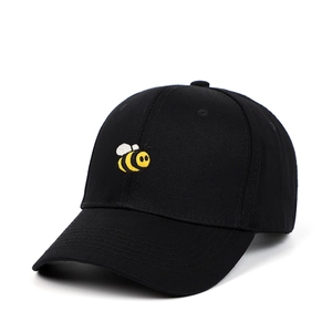Classic black baseball cap featuring a detailed yellow honey bee embroidery on cotton fabric